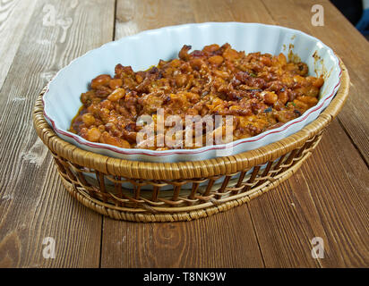 Poor Man Husband Casserole , beans   drain ground beef. Mix beef with garlic, salt, honey and tomato sauce Stock Photo