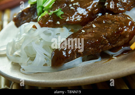 Honey Sriracha Mongolian Beef with Rice Noodles Stock Photo