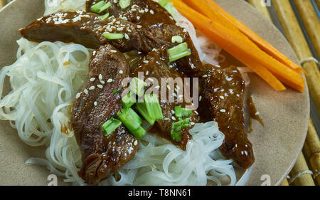 Honey Sriracha Mongolian Beef with Rice Noodles Stock Photo