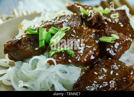 Honey Sriracha Mongolian Beef with Rice Noodles Stock Photo