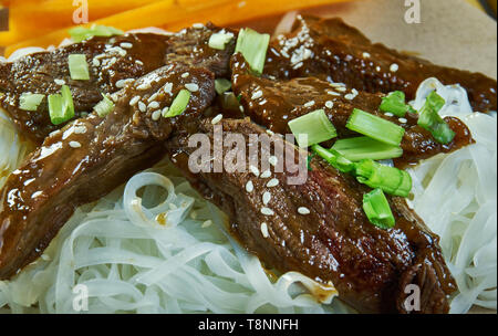 Honey Sriracha Mongolian Beef with Rice Noodles Stock Photo