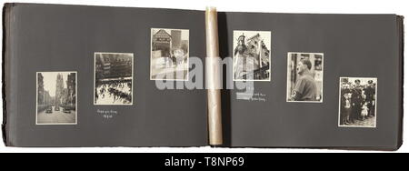 A photo album of the Reich Party Rally of Honour 1936 Large-size album with cardboard cover, the latter inscribed 'Parteitag 1936' and 'Property of: ...'. A unique, special album, all 145 photos (9 x 12 cm) were taken by Heinrich Hoffmann. The pictures were partially also used for the stereoscopic album (tr.) 'Reich Party Rally of Honour 1936'. They are of high quality, glued into the album and partially captioned. They show preparations for the parade, in an SS tent camp, Reichsführer SS H. Himmler visiting members of the Leibstandarte Adolf Hitler. Rudolf Heß, Gauleiter S, Editorial-Use-Only Stock Photo