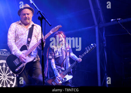 Mark Chadwick and Jeremy Cunningham performing with The Levellers at the Larmer Tree Festival near Salisbury, Wiltshire, England, UK. July 16, 2015 Stock Photo