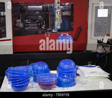Plastic bowl product from plastic injection molding press machine Stock Photo