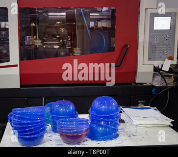 Plastic bowl product from plastic injection molding press machine Stock Photo
