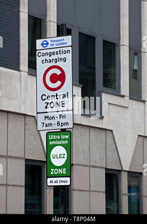 Congestion charging sign together with Ultra Low Emission Zone sign near Tower Bridge, London England. UK Stock Photo