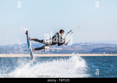 Kite surfer lifted into the air with spray Stock Photo
