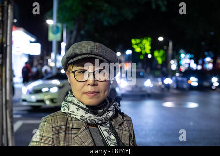Fashionable Taiwanese woman of Chinese ethnicity out on town in the evening Stock Photo