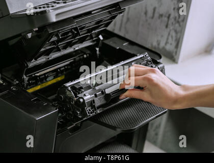 replacing the cartridge in the laser printer Stock Photo
