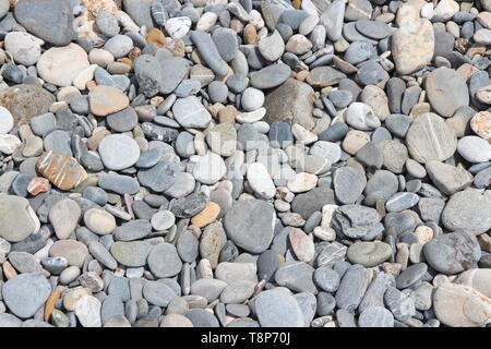 Pebbly beach background from Crete, Greece. Shingle beach. Stock Photo