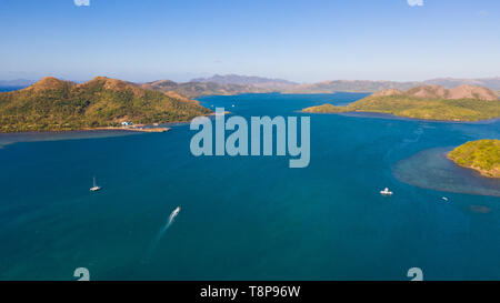 Seascape with islands. Blue sea and green islands, view from above.Boats ply between islands.