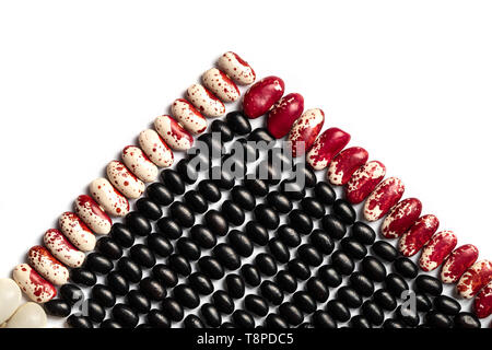 Pyramid of beans. Multicolored Legumes Textures: kidney beans, black eye, pinto on white background. Stock Photo