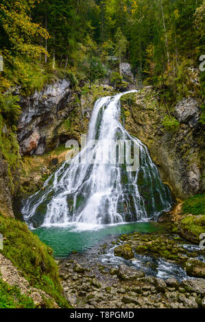 Gollinger Waterfall in Golling an der Salzach near Salzburg, Austria. Stunning view of cascade waterfall over mossy rocks in the Alps with long exposu Stock Photo