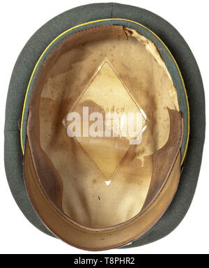 A visor cap for enlisted men and NCOs Waffen-SS signals troops Field-grey wool fabric (light moth traces), black trim band, lemon-yellow piping, beige inner liner (foxed), cap trapezoid of celluloid with imprinted, barely legible maker 'A.Podey Lübeck Marlistr.88', brown leather sweatband (one third missing), visor of vulcanised fibre, aluminium insignia, black patent leather straps in army issue. Caps for enlisted men of the Waffen-SS with pipings in this service branch colour are extremely rare because this regulation was standard for only a short time (usually the piping, Editorial-Use-Only Stock Photo