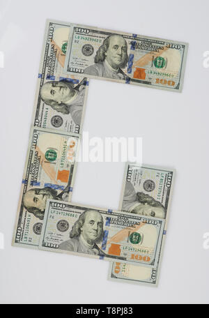 G letter made from dollar bill isolated on white background Stock Photo