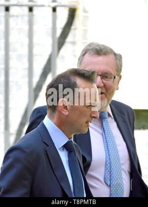 Alun Cairns MP (Secretary of State for Wales) and David Mundell MP (Secretary of State for Scotland) leaving a very long weekly Cabinet meeting in Downing Street, Westminster. London, UK. 14th May 2019. Stock Photo