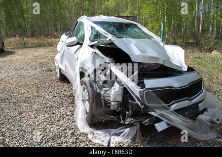 car after an accident in the parking lot, severe damage to the car after the accident, it is impossible to recover. Stock Photo