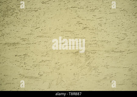 Monochromatic Grainy Texture of Yellow Plaster Wall on Bright Sun Stock Photo