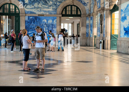 The São Bento Railway Station is a 20th-century railway station in central Porto, Portugal. Decorated in old Portuguese tiles or ceramic Azulejos Stock Photo