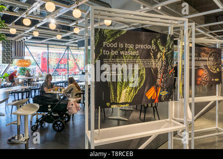 A sign about food waste in the restaurant of IKEA on the Greenwich Peninsula. Stock Photo