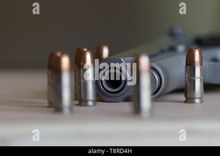 The gun on the table Stock Photo - Alamy