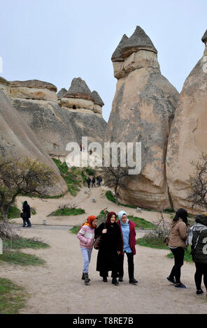 A group of young Muslim women visiting outdoor museum in Cappadocia, Turkey Stock Photo