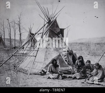 Vintage photo of a Tsuut'ina family in front of their teepee. Southern Alberta Canada circa 1886 - 1890 Stock Photo