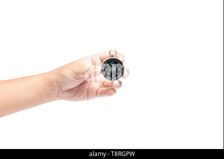 Hand holding compass isolated on white background, travelling or business direction concept with texting space. searching direction with compass. Stock Photo
