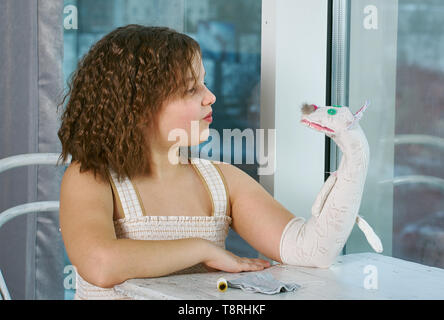 small girls expression playing  with hand puppets, Stock Photo