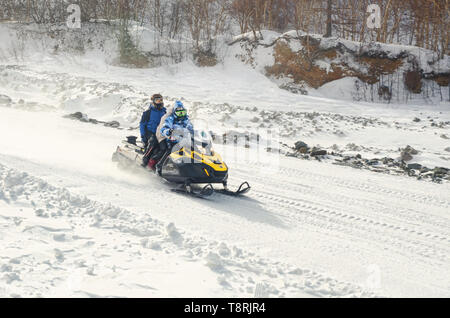 Tourist rides snow motor sled in Changbai Mountain Scenic Area Stock Photo