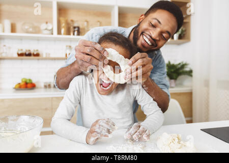 Father and daughter in kitchen Stock Photo
