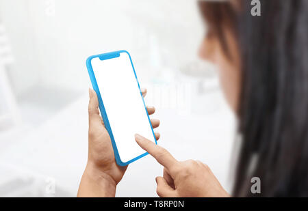 Flat blue smart phone concept mockup in woman hands. Stock Photo