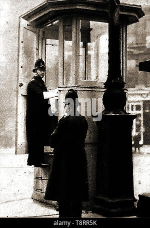An early historic photograph showing a police-box at Ludgate circus, London where police officers controlled traffic lights. Stock Photo