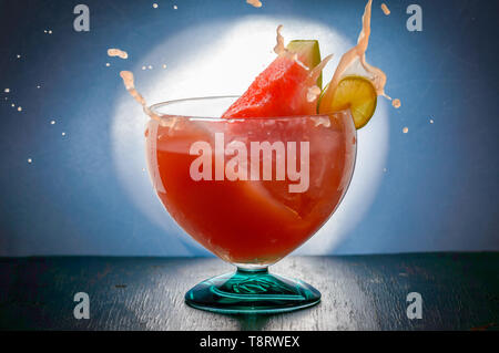 watermelon juice cocktail, splashing in glass, isolated on background, copy space Stock Photo