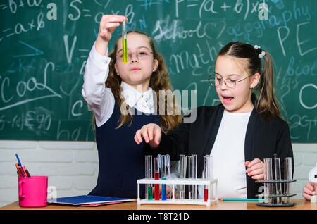 Little children. Science. Chemistry science. biology experiments with microscope. Lab microscope and testing tubes. Little kids scientist earning chemistry in school lab. Confident student studying. Stock Photo