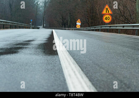 wet asphalt, solid white markings on the road Stock Photo