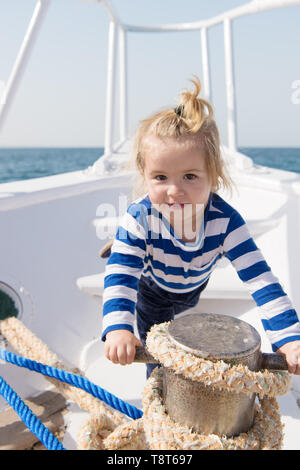 If you choose follow animators steps every day will seem like never ending party. Baby enjoy sea cruise. Boy sailor travel sea. Boy sea yacht travel around world. Sea traveller. Time for adventure. Stock Photo