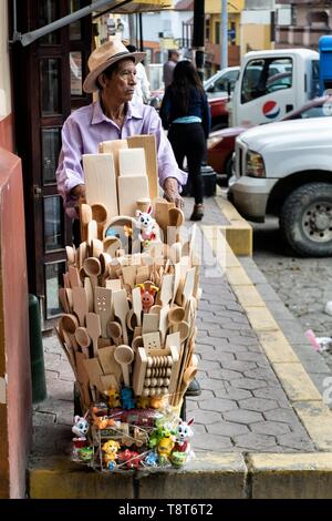 A street vendor sells hand carved wooden kitchen implements in Papantla, Veracruz, Mexico. Stock Photo