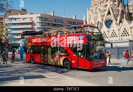 Barcelona, Spain - March 30, 2016: Barcelona city tour bus on street. Sightseeing and travelling. Transport for trip around Barcelona. Summer vacation in Barcelona. Stock Photo