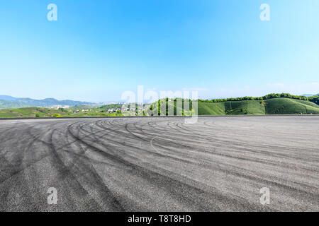 Asphalt race track ground and green mountains natural landscape Stock ...