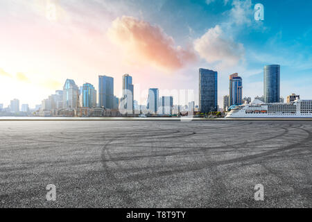 Empty race track and modern city skyline in Shanghai Stock Photo