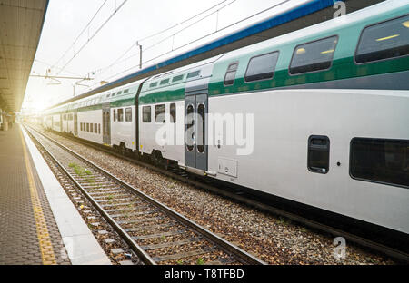 Double-decker train at the railway station in Italy. Stock Photo