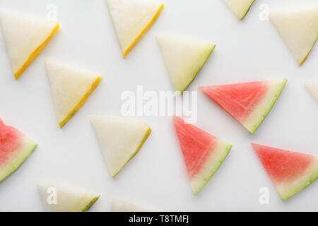 Slices of melon and watermelon on white background Stock Photo