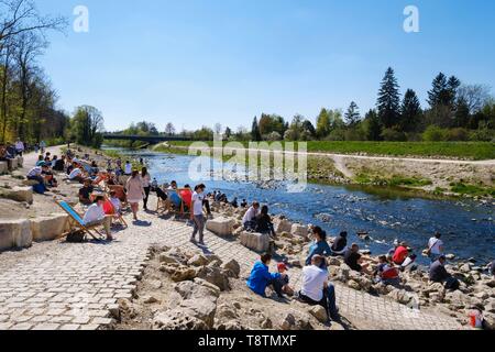People enjoy beautiful weather at the river Wertach, at the beer garden Kulperhutte, Augsburg-Goggingen, Swabia, Bavaria, Germany Stock Photo