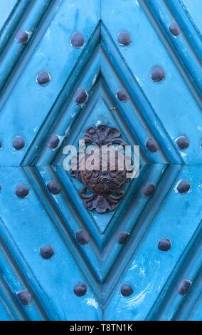 Historical doorknob on a blue front door, Bamberg, Upper Franconia, Bavaria, Germany Stock Photo