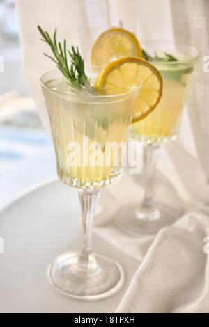 Glasses with delicious summer cocktail on windowsill Stock Photo