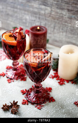 Glasses of delicious mulled wine on table Stock Photo