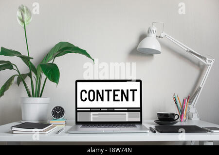 Content marketing concepts with text on computer laptop and accessories on worktable.Freelance or blogger Stock Photo