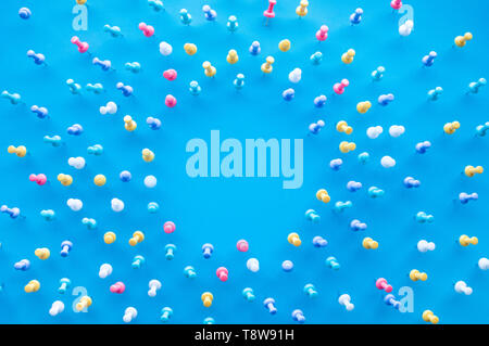 Top view group of pin,thumbtack with copy space on blue desk table background,business creativity ideas concepts Stock Photo