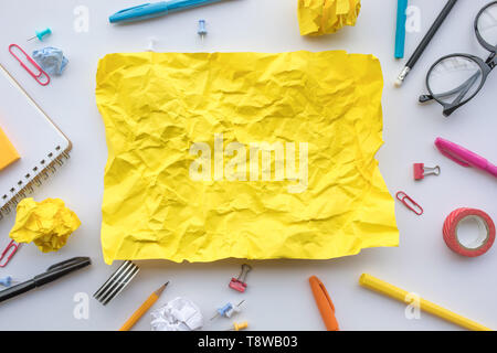 Inspiration creativity concepts with yellow paper crumpled on worktable.Business ideas solution and human performance.Top view Stock Photo